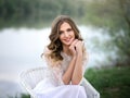 A beautiful woman with white teeth and a perfect smile. Happy sincere summer outdoor portrait of young attractive model Royalty Free Stock Photo