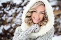 A beautiful woman with white teeth and a perfect smile. Happy sincere winter outdoor portrait of a attractive model Royalty Free Stock Photo