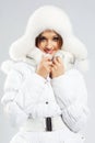 Beautiful woman in white winter clothing