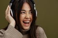 beautiful woman wireless headphones music fun technology Lifestyle Royalty Free Stock Photo