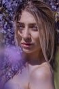 Beautiful woman in wisteria photoshoot portrait background beauty portrait photoshoot Royalty Free Stock Photo