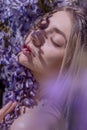 Beautiful woman in wisteria photoshoot portrait background beauty portrait photoshoot Royalty Free Stock Photo