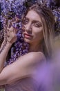 Beautiful woman in wisteria photoshoot portrait background beauty portrait photoshoot Royalty Free Stock Photo