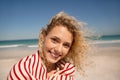 Beautiful woman wrapped in towel standing on the beach Royalty Free Stock Photo