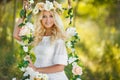 Beautiful woman with a wreath of flowers.