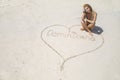 Beautiful woman writes on the sand on a Caribbean beach. Dominican Republic.Punta cana Royalty Free Stock Photo