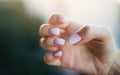 Beautiful woman& x27;s nails with beautiful french manicure ombre peach and white Royalty Free Stock Photo
