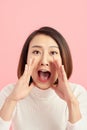 Beautiful woman yelling happily isolated on a white background