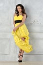 Beautiful woman in yellow evening dress. Royalty Free Stock Photo