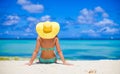 Beautiful woman in yellow hat on white tropical Royalty Free Stock Photo