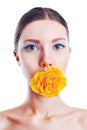 Beautiful woman with yellow rose flower in her mouth Royalty Free Stock Photo