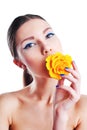 Beautiful woman with yellow rose flower in her mouth Royalty Free Stock Photo