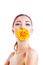 Beautiful woman with yellow rose flower in her mouth Royalty Free Stock Photo