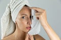 Beautiful women applying facial mask with moisturizer Royalty Free Stock Photo