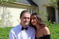 Beautiful woman in back prom dress and handsome guy in suit, teenager ready for a luxury night. Royalty Free Stock Photo