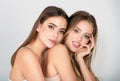 Beautiful women with beauty makeup and cosmetics. Close-up of couple beautiful girlfriends models. Two attractive