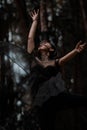 Beautiful women with black ballet costumes flying in the air like reaching something in the sky Royalty Free Stock Photo