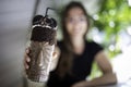 Beautiful women blurred holding a chocolate shake and cookies on a transparent glass with aboriginal design