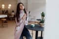 Beautiful women in a coffee shop with a cup of coffee Royalty Free Stock Photo