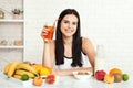 Beautiful women exists with pure skin on her face sitting at a table and eat breakfast. Asian woman eating healthy food at Royalty Free Stock Photo