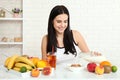 Beautiful women exists with pure skin on her face sitting at a table and eat breakfast. Asian woman eating healthy food at Royalty Free Stock Photo