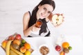 Beautiful women exists with pure skin on her face sitting at a table and eat breakfast. Asian woman eating healthy food at Royalty Free Stock Photo