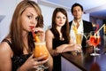 Beautiful women with friends at the bar Royalty Free Stock Photo