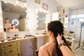 Beautiful woman getting haircut by hairdresser in the beauty salon. Royalty Free Stock Photo