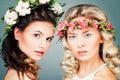 Beautiful Women with Permed Hairstyle, Makeup and Flowers Royalty Free Stock Photo