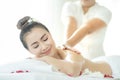 Beautiful woman in spa. Spa oil massage for relaxation. Asian woman in wellness beauty spa having aroma therapy massage with