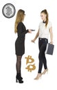 Beautiful women standing over white background with bitcoin sketches and talking. Virtual money concept. Cryptocurrency Royalty Free Stock Photo