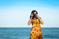 beautiful women take camera at the sea