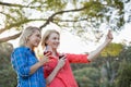 Beautiful women taking a selfie from mobile phone Royalty Free Stock Photo