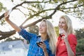 Beautiful women taking a selfie from mobile phone Royalty Free Stock Photo