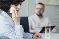 Woman wipes her tears while talking to the therapist Royalty Free Stock Photo