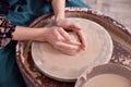 Beautiful women& x27;s hands make ceramic dishes on a potter& x27;s wheel Royalty Free Stock Photo