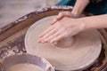 Beautiful women& x27;s hands make ceramic dishes on a potter& x27;s wheel. Royalty Free Stock Photo