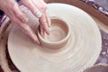Beautiful women& x27;s hands make ceramic dishes on a spinning potter& x27;s wheel. soft focus. Royalty Free Stock Photo