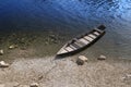 Beautiful wooden boat at edge of river, peaceful calm relaxing scene