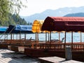 Beautiful wooden boat on famous Bled Lake in Slovenia. Bled Lake, known for its castle and island, is popular travel destination Royalty Free Stock Photo