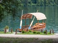 Beautiful wooden boat on famous Bled Lake in Slovenia. Bled Lake, known for its castle and island, is popular travel destination Royalty Free Stock Photo
