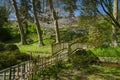 Beautiful wooden bridge in an oriental park Royalty Free Stock Photo