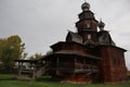 Beautiful wooden brown Christian old Church on a rainy day in summer