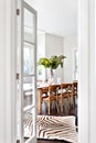 Beautiful wooden dining table in drawing room of luxury house Royalty Free Stock Photo