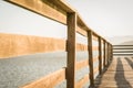 Beautiful wooden dock in pond overlooking mountains, quiet view Royalty Free Stock Photo