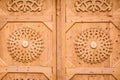 Beautiful wooden doors with traditional ornaments without handle Royalty Free Stock Photo