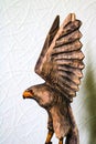 Beautiful wooden figure of an eagle on a white background Royalty Free Stock Photo