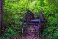 wooden handmade bridge in the footpath forest