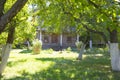 Beautiful wooden home in apple orchard summertime Royalty Free Stock Photo