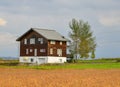 Beautiful wooden house on the field Royalty Free Stock Photo